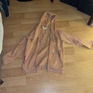A pink butterfly zip up hoodie.